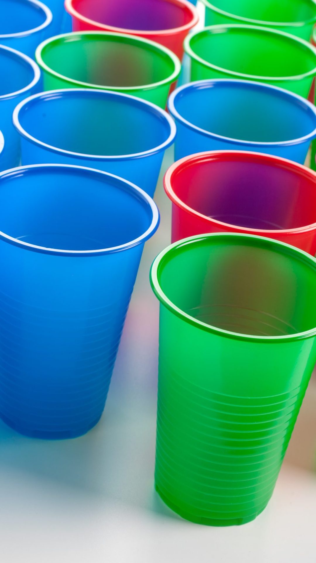 Multicolor plastic glasses isolated on white background